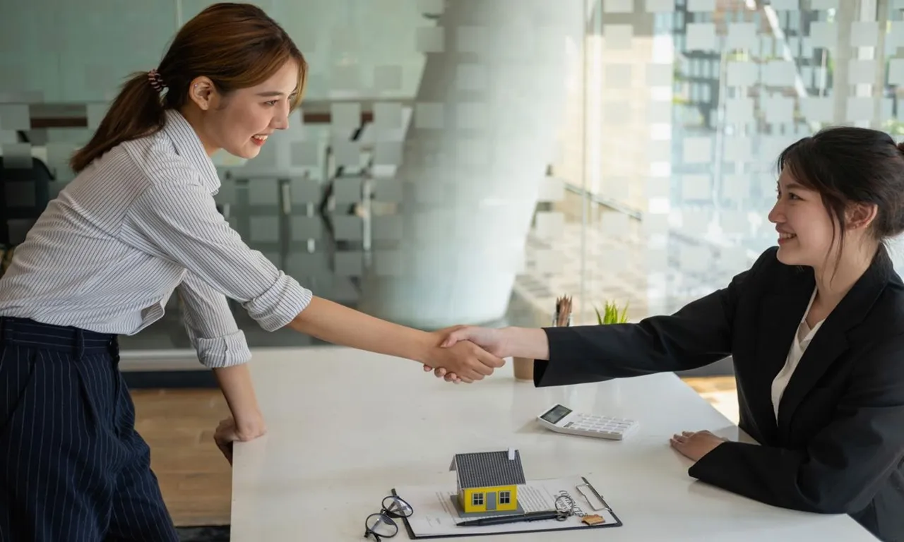 Home buying with negotiation support showing a buyer and real estate professional reviewing contracts, negotiating purchase terms, and successfully closing on a new home.